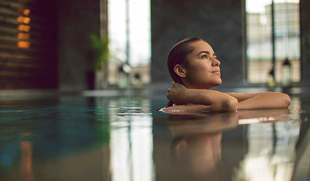 woman in pool at water level.